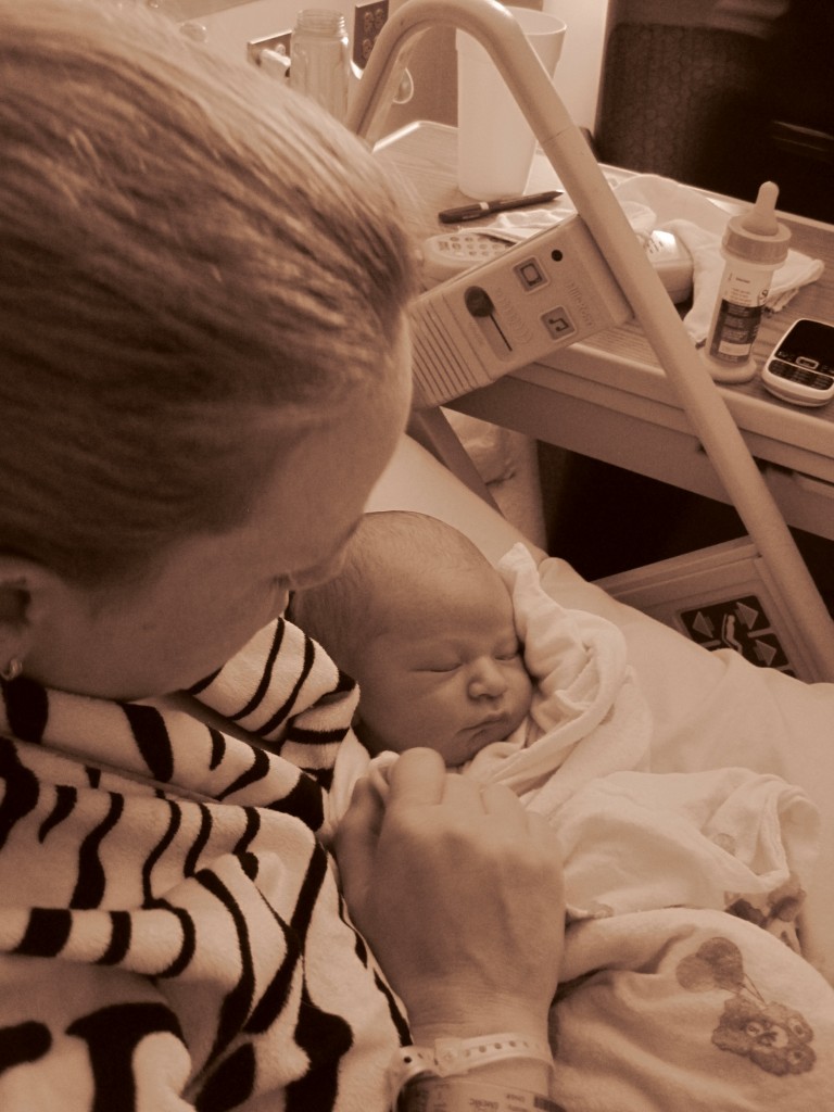 Abby Theuring, The Badass Breastfeeder, with a bottle of formula nearby.