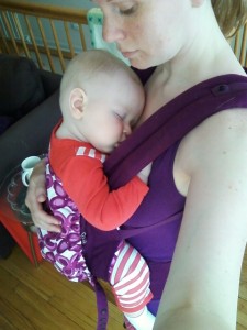 Abby Theuring, The Badass Breastfeeder babywearing her son. 