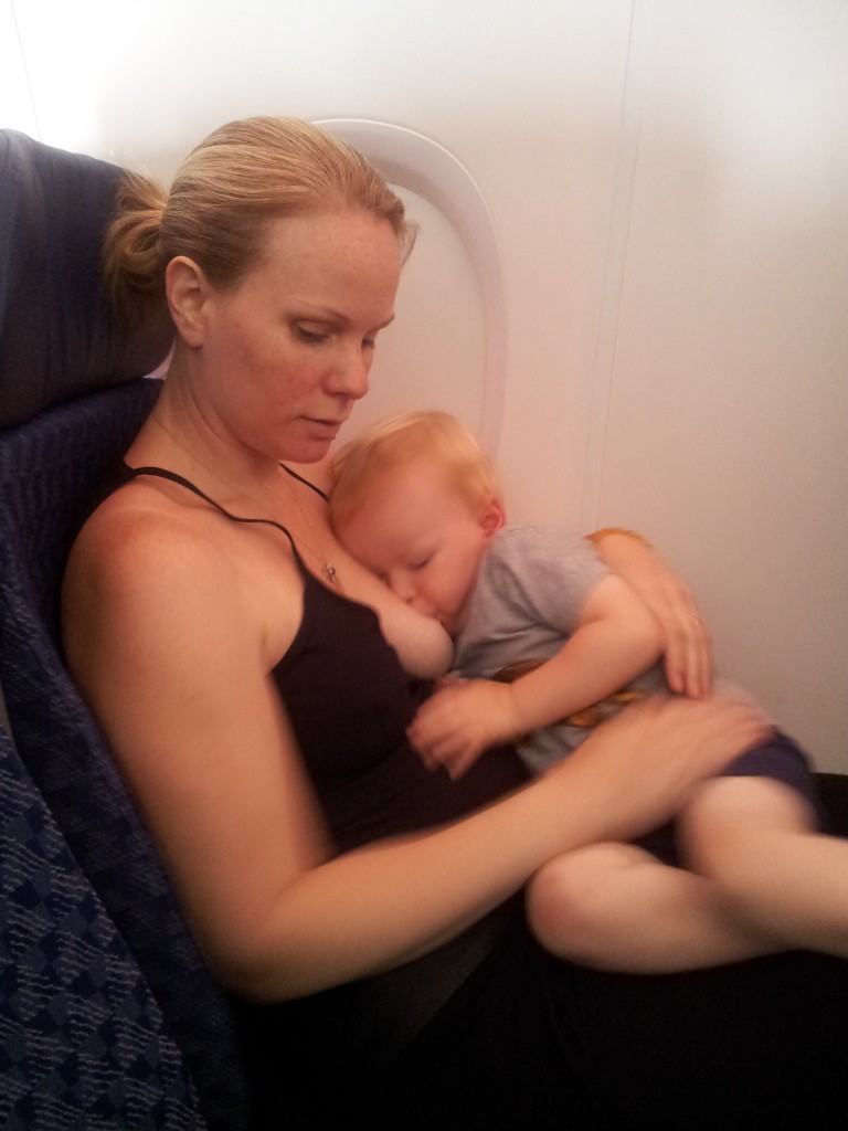 Abby Theuring, The Badass Breastfeeder, breastfeeding on an airplane. 