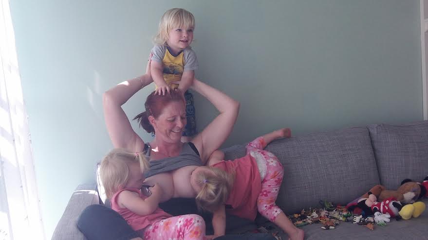 Davina breastfeeding her triplets 