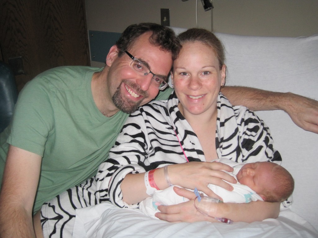 Abby Theuring, The Badass Breastfeeder, with husband and newborn