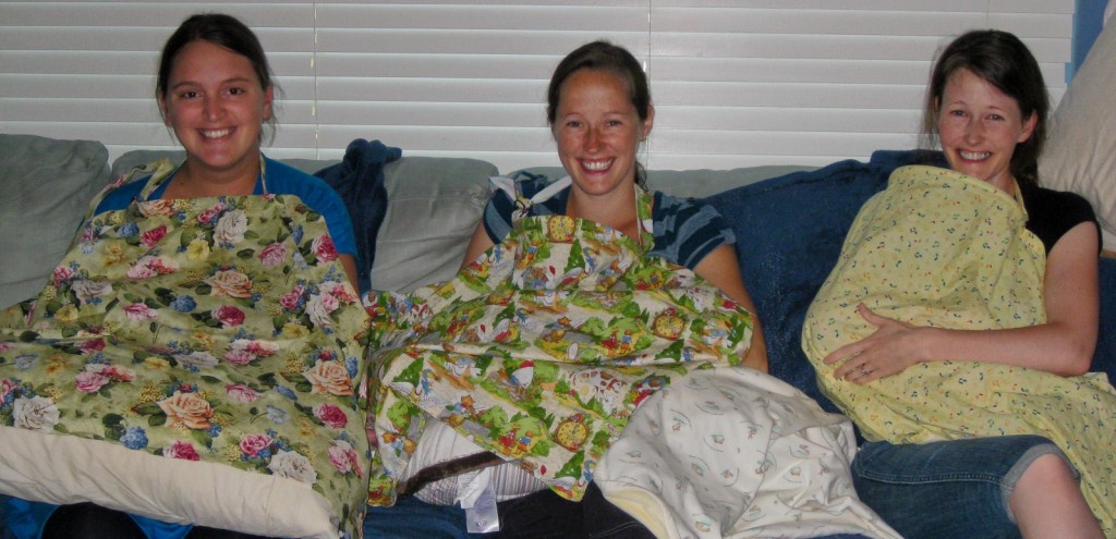 Badass Breastfeeder Juliana using a nursing cover while breastfeeding in public. 