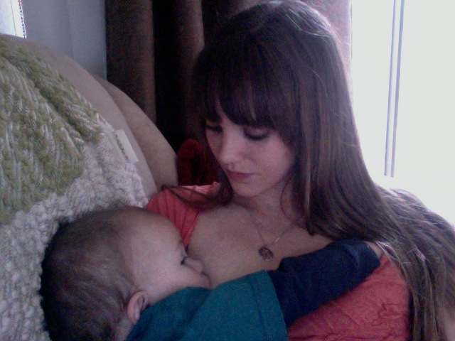 Melody breastfeeding her baby. 