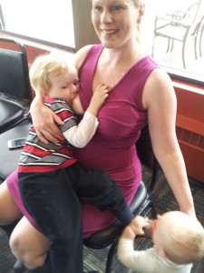 Abby Theuring, The Badass breastfeeder breastfeeding her toddler.
