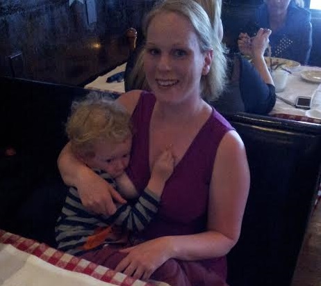 Abby Theuring, The Badass Breastfeeder breastfeeding her toddler. 