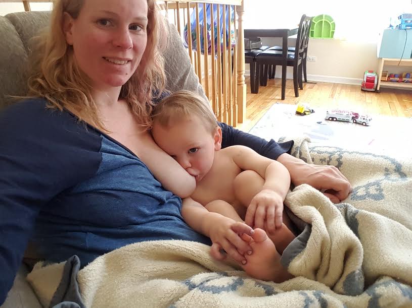 Abby Theuring, The Badass Breastfeeder, breastfeeding her son. 